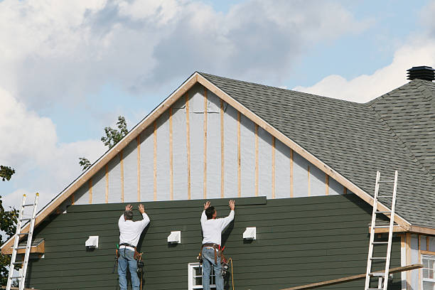 Professional Storm Damage Siding Repair technician working in Melrose, MN
